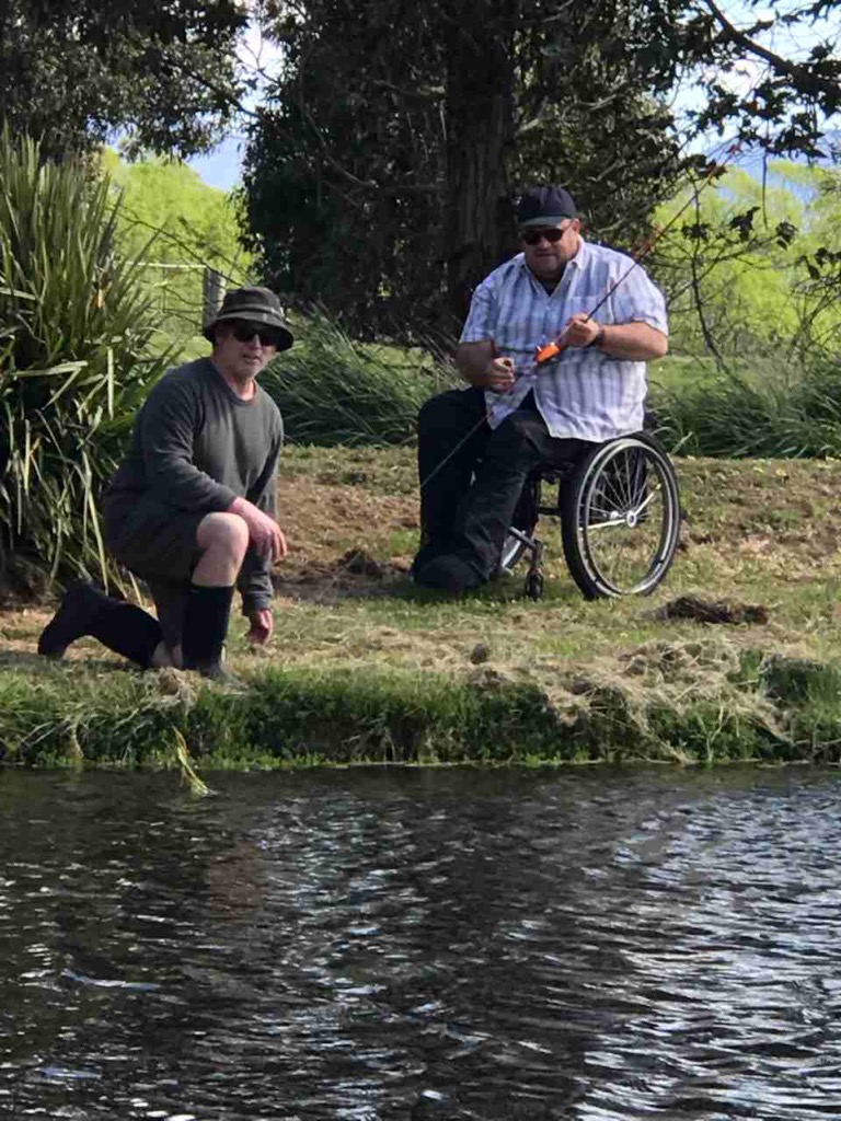 Casting Pool guide, Jim Morris, helps Hamish Murray christen his cane rod